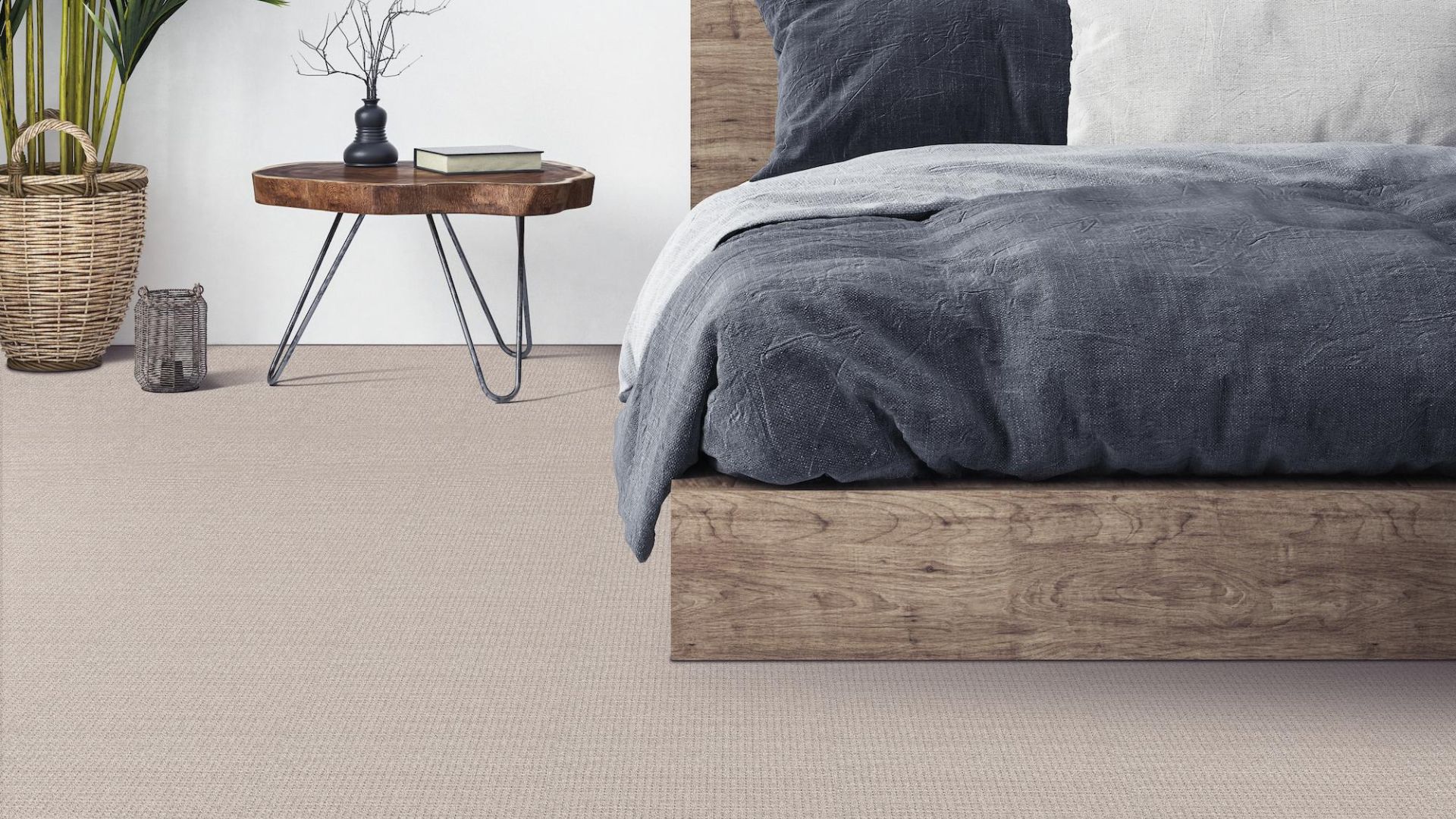 neutral beige carpets in a bedroom with wood bedframe and side table